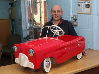 Ian Taylor with his restored pedal car